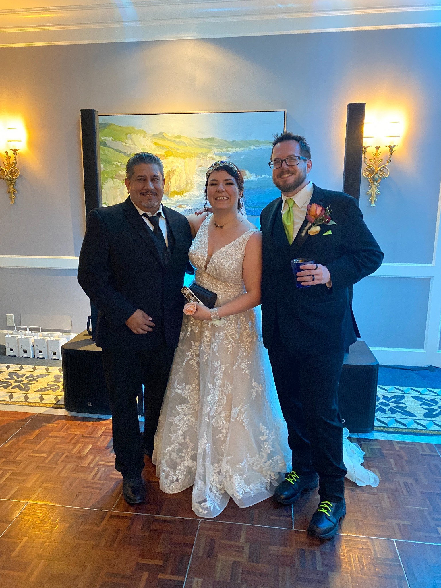 Rey standing with a wedding couple
