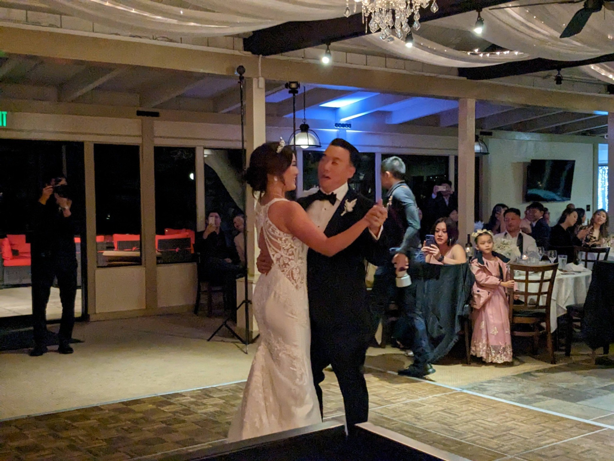 A couple sharing their first dance at their wedding reception